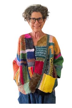 an older woman is wearing a multicolored sweater