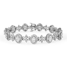 Exquisite and elegant oval diamond and round diamond bracelet. 9.67 carats total gemstone weight. 11 oval diamonds, 4.38 carats. Approximately F/G color and VS2 clarity. Complimented by 246 round brilliant diamonds, 5.29 carats. Approximately G color and VS2 clarity. 18k white gold, 15.08 grams, 6.9 inches.  Accommodated with an up-to-date appraisal by a GIA G.G. once purchased, upon request. Please contact us with any questions. Luxury White Oval Diamond Bracelet, Luxury Oval Diamond White Diamond Bracelet, Luxury Diamond White Oval Diamond Bracelet, Dazzling Oval Diamond Bracelet, Exquisite Oval Diamond Bracelet, Oval Diamond Bracelet With 17 Jewels, Luxury Oval Diamond Cut Bracelet, Luxury Oval Diamond White Bracelets, Exquisite Oval Diamond Bracelet For Formal Occasions