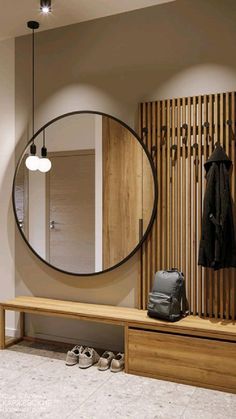 a coat rack and mirror in a room