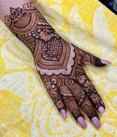 henna tattoo on the palm of someone's hand