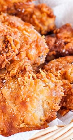 some fried food is in a basket on the table