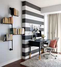 the home office is decorated in black and white stripes