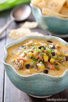 a bowl of mexican soup with tortilla chips on the side