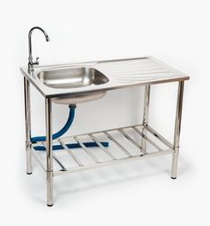 a stainless steel sink with a hose attached to it and a drainer on the side