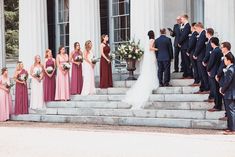 a group of people standing on steps next to each other in front of a building