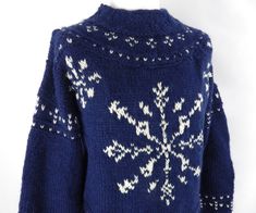 A stunning vintage chunky knit sweater.  It is a rustic piece featuring a large snowflake motif.  Size: M UK Approx Chest: 44" Pit to pit: 22" Pit to cuff: 21" Collar to cuff: 28" Length: 28" It is in lovely condition and comes from a smoke free home.  Please take a look at our huge range of other vintage and quirky knitwear Please contact me if you would like to combine postage on multiple items. Quirky Knitwear, Chunky Hand Knit, Hand Knitted Jumpers, Pullover Sweater Men, Wool Jumper, Chunky Wool, Blue Snowflakes, Sweater Pullover, Chunky Knits Sweater