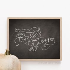 a chalkboard with the words thanks and giving written on it next to a pumpkin