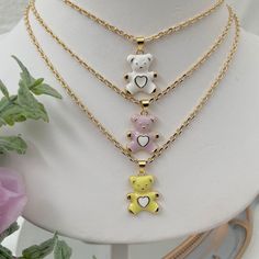 If you are a mama bear, this cute teddy bear necklace is for you! This dainty gold plated necklace is perfect for everyday wear. 💕 ITEM DESCRIPTION: Total length: 14 - 16 - 18 -20 -22  inches. The length of the necklace refers to the total length from end-to-end. Pendant height: 1 inch Pendant width: 0.7 inch Material: 18K Gold Plated Chain - Enamel Bear Charm. Chain color available: Gold. Bear Charm Color Available: Lilac - White - Yellow 💕 GIFT IT Jewelry comes in a cute bag ready to gift! I Cute Gold Clavicle Chain Jewelry, Cute Heart Pendant Charm Necklace For Best Friend, Cute Gold Charm Necklaces With Clavicle Chain, Cute Gold Charm Necklace With Clavicle Chain, Cute Everyday Necklaces With Charms, Cute Everyday Necklace With Adjustable Chain, Dainty White Necklace For Best Friend Gift, Trendy Gold Necklace For Best Friend, Cute Gold Pendant Charm Necklaces