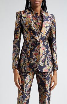 Signature paisley designs swirl across this sharp-shouldered satin blazer designed with peaked lapels and a clean back vent. 27" length (size 38IT) Two-button closure Peaked lapels Front patch pockets Back vent 100% polyester Dry clean Made in Italy Designer Clothing Elegant Floral Print Suit For Formal Occasions, Elegant Formal Suits With Floral Print, Elegant Floral Print Suits For Formal Occasions, Tailored Floral Print Outerwear For Formal Occasions, Designer Silk Blazer With Lapel Collar, Patterned Suits Women, Formal Fitted Outerwear With Floral Print, Elegant Formal Outerwear With Floral Print, Elegant Long Sleeve Suits With Floral Print