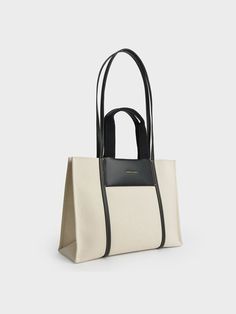 A bag to beat all other bags when it comes to structure, style or functionality. Featuring a boxy finish, double top handles, and a roomy interior, our boxy canvas Shalia tote is perfectly sized to carry all of your essentials in style. Relish being hands-free when you wear it on your shoulder and head to work. Complete with a zip closure that ensures your daily necessities stay safe, we think it will go well with a pinstripe pantsuit and textured mules. Charles And Keith Bags, Charles And Keith, Uni Style, Buy Bags, Flatform Sandals, Size Chart For Kids, Charles Keith, Everyday Bag, Online Bags