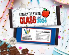 congratulations class of 2012 candy bar wrapper with an apple and pencils next to it