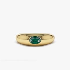 This 14k Gold Dome ring showcases a gorgeous 6x4mm oval cut natural emerald in a rich green color. The emerald is flush set in a 14k gold dome band that adds a touch of elegance and luxury to the ring. The emerald is considered as a symbol of love, growth, and rebirth. As the birthstone for May, this ring is a perfect way to celebrate a birthday or anniversary. The oval cut of the emerald adds a touch of vintage elegance to the ring, making it perfect for both formal and casual occasions. The 14k gold material of the band ensures the durability and longevity of the ring while adding a touch of warmth to it. ▶ Item Details * Made to Order * Gold Kt: 14K Solid Gold (also available in 18K) * Available Gold Colors: Rose Gold, Yellow Gold, White Gold * Oval Emerald: 1 pc 6 X 4 MM * Emerald Cara Oval Emerald Birthstone Ring In Fine Jewelry Style, Oval Polished Emerald Ring In 14k Gold, Oval Emerald Ring With Polished Finish In 14k Gold, Oval Emerald Ring In 14k Gold With Polished Finish, Oval Emerald Ring With Bezel Setting, Oval 14k Gold Emerald Ring, Oval Yellow Gold Emerald Ring With Polished Finish, Timeless Yellow Gold Oval Emerald Ring, Timeless Yellow Gold Emerald Ring With Oval Shape