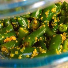 green peppers with sesame seeds in a glass bowl