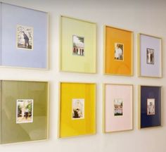 a wall with many different colored frames on it