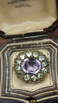 Georgian/Victorian Portuguese Stunning Exclusive Exeptional European Brooch...Brooch made with 9k Gold, Chrysoberyl and Amethyst, Foiled Back..Unique and One Of A Kind..Can be converted to ring, look stunning and a Pendant or Ring, like showed on the pics.Amethyst necklace is NOT included, just to show.Only brooch...Very good Antique Condition..Layaway available. Heirloom Yellow Gold Gemstone Brooches, Purple Gemstone Brooches For Weddings, Purple Gemstone Wedding Brooches, Antique Gold Brooch With Cabochon, Elegant Gold Amethyst Brooches, Luxury Antique Cabochon Brooches, Dispersion Of Light, Victorian Multi-stone Wedding Brooches, Luxury Antique Purple Brooches