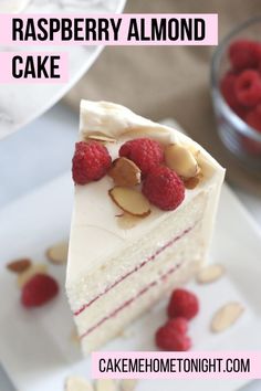 raspberry almond cake with white frosting and fresh raspberries on top