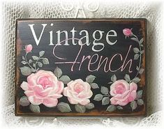 a sign that says vintage french with pink roses