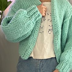 Cozy up in this thick-knit, slightly cropped cardigan. Mint aquamarine color, size S/M. Ready-to-wear! Casual Green Knit Cardigan, Green Cropped Sweater For Winter, Cozy Cropped Cardigan For Winter, Cozy Green Soft Knit Cropped Sweater, Green Cozy Soft Knit Cropped Sweater, Green Cozy Cropped Soft Knit Sweater, Green Cozy Cropped Sweater With Soft Knit, Casual Knitted Cropped Sweater For Fall, Casual Green Chunky Knit Cardigan