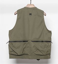 Give a new dimension to your wardrobe with this techwear tactical vest. Unveil the newest evolution in urban fashion - the Futuristic Vest. This innovative piece is far from ordinary, meticulously designed to redefine the standards of style and functionality. It embodies futuristic wear, a transformative gear for those who refuse to blend into the crowd, an invitation to embrace the futuristic style. Crafted to elevate your techwear outfits, this vest is a design masterpiece steeped in Japanese Streetwear and alternative fashion aesthetics. It speaks to young urbanites, those who appreciate the intricate beauty of standout and functional clothing that serves them all year round. The elegance of this futuristic vest for men lies in its dual-layered construction, a silhouette that adds depth Techwear Nylon Vest For Streetwear, Techwear Vest With Cargo Pockets, Techwear Sleeveless Vest With Multiple Pockets, Techwear Sleeveless Vest With Cargo Pockets, Sleeveless Techwear Vest With Cargo Pockets, Sleeveless Techwear Vest, Outdoor Techwear Vest With Cargo Pockets, Outdoor Techwear Sleeveless Vest, Techwear Vest With Multiple Pockets For Streetwear