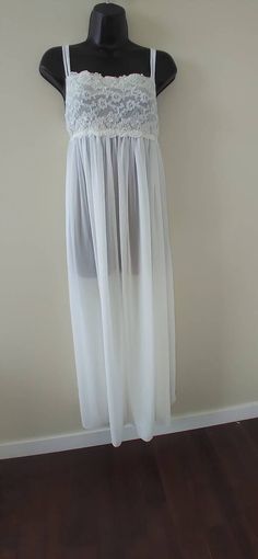 Absolutely stunning full length vintage nightgown,In Bloom by Jonquil. Top is lace with beading. Has adjustable straps,3 straps in front to a single adjustable in back. Has a tie at the bodice. Size Medium with stretch. Would make a beautiful option to wear on your wedding night,special occasion/date night or just to feel beautiful while lounging.The soft flowing sheer fabric feels and looks incredible. In excellent vintage condition. Wire Rimmed Glasses, Nightgown Lingerie, In Bloom By Jonquil, Lingerie Bridal, Vintage Nightgown, Women's Nightgowns, Vintage Glam, Feel Beautiful, Nightgowns