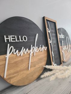 three wooden signs that say hello pumpkin and hello fall on the side of a wall