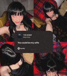 a woman with black hair sitting on top of a red plaid couch next to a pillow