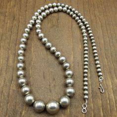 "This is a classy vintage sterling silver graduated bead necklace. The necklace measures 14 1/2\" long. The largest center silver bead measures approximately 5/8\". The smaller beads near the shepherds hook measures 1/4\". This item does not have hallmarks or stamps. The beautiful simple design allows this piece to be styled for every day wear, or for a special occasion. Please feel free to message us if you have any questions. Thank you for shopping with us. ( NECK-10-AV-NK-22" Classy Vintage, Shepherds Hook, Silver Chain Style, Sterling Silver Cuff Bracelet, Vintage Navajo, Copper Bracelet, Silver Bead, Sterling Silver Cuff, Silver Cuff Bracelet