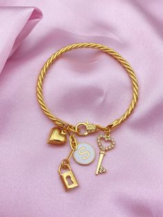 Custom Heart Lock and Key Charm Bangle Bracelet,Personalized Charm Bracelet,Bangle Bracelet for Women,Personalized Gifts,Gift for Her PRODUCT DETAILS ; The product is 18K Brass Gold Plated. Adjustable. Designed with 4 Charms in total. It is sent with personalized letter. You need to write your initial in the personalization section. This bracelet is an elegant and special design representing love that you can get on special occasions. It's time to pamper your loved ones or yourself by customizin Bracelet Breloques, Heart Lock And Key, Jewelry Cleaning Solution, Heart Lock, Gold Charm Bracelet, Professional Jewelry, Bangle Bracelets With Charms, Lock And Key, Charm Bangle