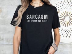 The Bella+Canvas Shirts are so soft. They are one of our favorites. Let your shirt say it all with this "Sarcasm like a warm hug really," T-shirt with distressed lettering. Perfect for anyone with a sense of humor. It's a unisex, buttery soft, jersey short sleeve tee that fits like a well-loved favorite. Soft cotton and quality print make users fall in love with it over and over again. These t-shirts have-ribbed knit collars to bolster shaping. The shoulders are tapered for a better fit over tim Sarcastic Shirts Women Inspire Uplift ⭐, Sarcasm T-shirt, Sarcasm Shirts For Women, Distressed Lettering, Funny Tees Women, Sarcasm Shirts, Tshirt For Women, Funny Tshirt, Warm Hug