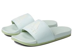 adidas Adilette Comfort Slides - Women's Sandals : Linen Green/Zero Metallic/Magic Lime : Slide into blissful comfort after a long day with the adidas Adilette Comfort Slides. Synthetic uppers with 3-stripes or adidas logo and an open toe. Easy slip-on slide. Soft fabric linings. Features a Cloudfoam Plus footbed designed to help you recharge with pillow-soft cushioning. Lightweight EVA outsole. Please note, sizes listed refer to US sizing, but product shipped may be stamped with additional size Athleisure Sports Slides For Summer, Sporty Slides With Removable Insole For Spring, Sporty Slides For Spring Leisure, Sports Open Toe Slides With Adidas Logo, Spring Sports Slides With Textured Footbed, Sports Slides With Adidas Logo And Open Toe, Open Toe Adidas Slides For Sports, Sporty Adidas Slides For Beach, Sporty Synthetic Slides