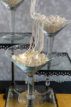 8 Elegant DIY Great Gatsby Centerpieces | Great Gatsby Party Diy Gatsby Party, Gatsby Party Centerpieces, Great Gatsby Centerpieces, 20s Party Decor, Gatsby Centerpieces, Roaring 20s Birthday Party, 20s Party Decorations, Gatsby Birthday Party, Ostrich Feather Centerpieces