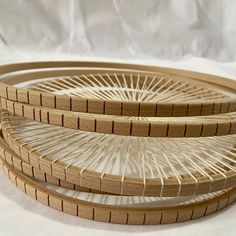 three woven baskets sitting on top of each other