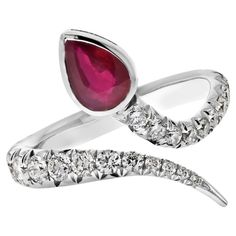 Unveiling the Majestic Serpent: Platinum Diamond and Ruby Wrap Serpent Handmade Ring Step into a world of enchantment with this exquisitely handcrafted platinum ring. The design encapsulates the grace and allure of a serpent elegantly wrapping around your finger, and it's adorned with mesmerizing pear-cut red ruby and glistening round-cut diamonds. **A Precious Pear-Cut Ruby** At the heart of this splendid creation lies a pear-cut red ruby, the embodiment of passion and vitality. With a weight o Serpent Ring, Platinum Ring, Round Cut Diamond, Cocktail Rings, Essence, Timeless Pieces, Handmade Ring, Ruby, Platinum