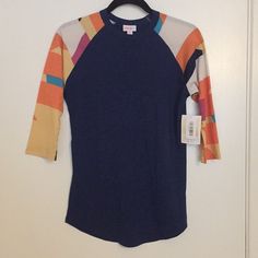 This Is A Brand New Lularoe Randy T-Shirt. It Is A Sort Of Base Ball Style Tee, Where The Body Is One Color And The Sleeves Are Another. Navy Blue Body With Multicolored Sleeves. Sleeves Are 3/4 Length. Price Is Firm. Thanks For Looking. Blue Raglan Sleeve Tops For Spring, Multicolor Stretch T-shirt For Fall, Blue Raglan Sleeve T-shirt For Summer, Spring Blue Color Block T-shirt, Blue Stretch T-shirt For Fall, Baseball Tops, Raglan Sleeve Top, Base Ball, Purple Pattern