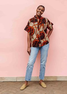 Model wearing beige shirt with brown and orange circles and lines. Ankara Shirts Women, Modern African Print Dresses, Short Sleeve Shirt Outfit, Tailor Design, Kitenge Dress, Kitenge Designs, Kitenge Fashion, African Tops, Celebrate Good Times