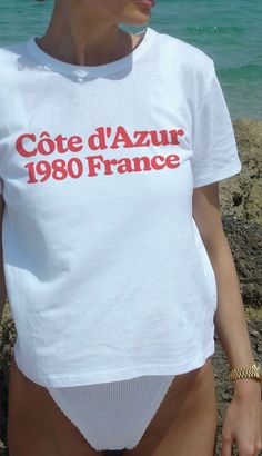 Take a timeless trip to the French Riviera with our Côte d'Azur 1980 France Graphic Tee. Designed for those who appreciate retro flair and modern comfort. Unisex soft cotton crew neck t-shirt featuring a red Côte d'Azur 1980 France graphic printed on the front side. Fabrics: 100% cotton, 6.1 oz Made in: LA San Tropez, Retro Graphic Tees, Devil Wears Prada, Retro Summer, French Chic, French Riviera, Short En Jean, 로고 디자인, Saint Tropez