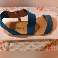 Brand New Aerosoles Sandals In Box. Super Comfy Sole, Elastic Ankle Band. Blue Open Toe Sandals With Ortholite Insole, Blue Sandals With Ortholite Insole For Beach, Blue Ortholite Insole Sandals For Beach, Blue Adjustable Sandals With Cushioned Footbed, Adjustable Blue Sandals With Cushioned Footbed, Adjustable Blue Synthetic Sandals, Comfortable Adjustable Blue Sandals, Blue Flat Sandals With Arch Support, Blue Synthetic Sandals With Cushioned Footbed