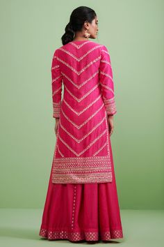 Pink kurta highlighted with gota embroidered yoke, round neckline, concealed placket and Straight silhouette. Comes with sharara and organza dupatta.
Component: 3
Embroidered
Neckline: Round
Sleeve Length: Full
Fabric: Chanderi, Viscose Organza, Chanderi Brocade
Color: Pink
Straight kurta
Brocade panelled sharara
Gota embroidered dupatta with tassels - Aza Fashions Embroidered Sharara, Blouse Yoke, Kurta Set For Women, Bridal Lehengas, Embroidered Border, Casual Tunics, Sharara Set, Organza Dupatta, Embroidered Neckline