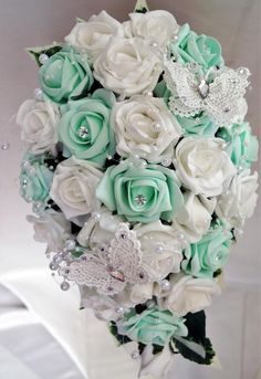 a bridal bouquet with white and mint green flowers