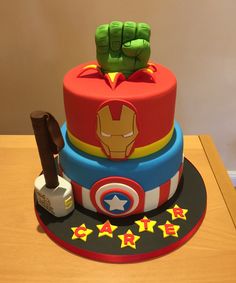 a birthday cake made to look like the avengerss and captain america characters are stacked on top of each other