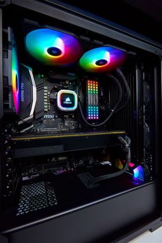 the inside of a computer case with colorful lights