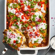 an enchilada casserole with sour cream and salsa