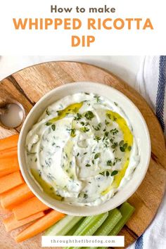 a white bowl filled with whipped ricotta dip surrounded by carrots and celery