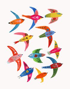 colorful birds are flying in the air together