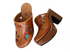 A pair of leather embroidered Clogs, Platform sole. Content + Care: - Padded insole, textured outsole. - Non-slip tread on sole - Genuine Leather - All handmade. Measurements: Heel height: 3.5 in. Platform: 1.4 in. Handmade proudly in Mexico. If you have any question or need more information, don't hesitate to contact me, I am happy to help! ★ Take a look to all my work https://www.etsy.com/shop/xankla ★ Traditional Leather Sandals With Wooden Heel, Traditional Sandals With Wooden Heel, Traditional Open Toe Spring Clogs, Traditional Open Toe Clogs For Spring, Traditional Slip-on Clogs With Rubber Sole, Traditional Closed Toe Clogs With Leather Sole, Traditional Brown Slip-on Clogs, Traditional Open Toe Clogs With Leather Sole, Traditional Leather Mules For Spring