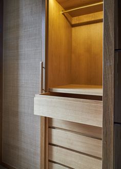 an empty wooden cabinet in a room