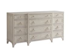 a large white dresser with many drawers