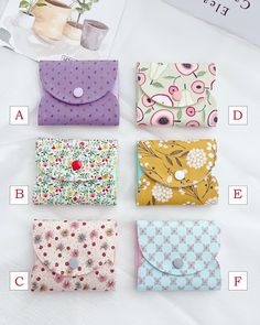 four different types of purses on a white sheet with the names and numbers below them