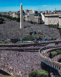 an aerial view of the washington monument and people gathered in front of it for a rally