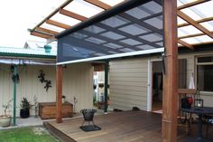 a wooden deck with an awning over it